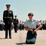 The colonel nicknamed Hammer, feared by everyone in the military academy, humiliated a young female recruit and forced her onto her knees in front of the entire company… but when the girl silently pulled THIS out of her pocket, the whole parade ground froze in shock